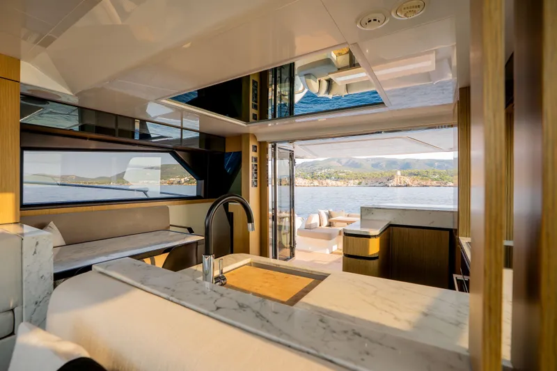 Travitude Yacht Photos Pics Luxurious interior of 2020 Pearl 62 yacht with scenic ocean view.