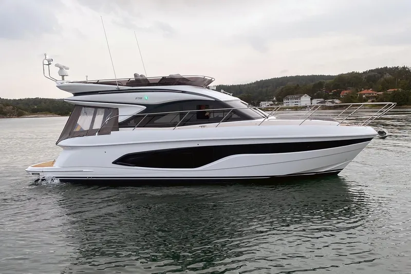 F45110 Yacht Photos Pics 2024 Princess F45 yacht cruising on calm waters, showcasing sleek design and modern features.