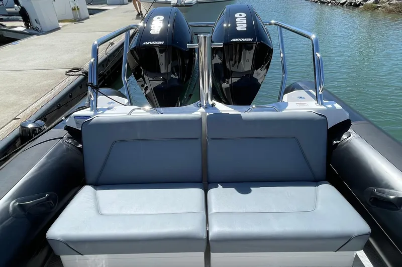  Yacht Photos Pics 2024 Protector 310 Targa boat with dual Mercury outboard engines at dock.