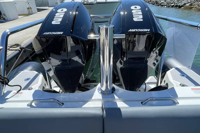  Yacht Photos Pics 2024 Protector 310 Targa boat with dual Mercury outboard engines at dock.