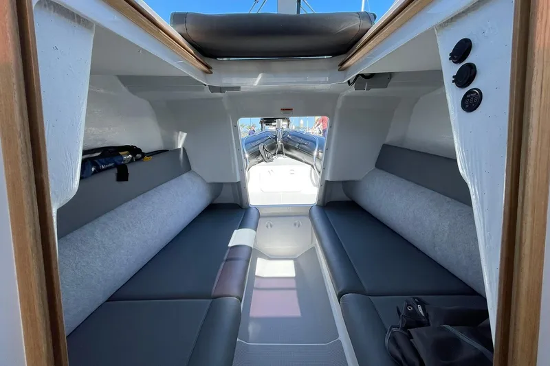  Yacht Photos Pics Interior of 2024 Protector 310 Targa boat, featuring sleek seating and modern design.