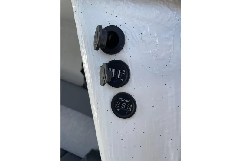  Yacht Photos Pics 2024 Protector 310 Targa utility panel with USB ports and voltage display.