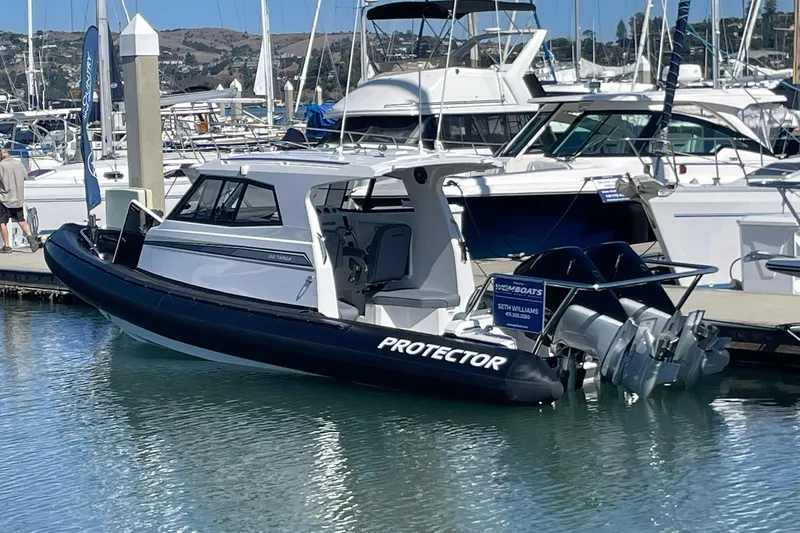  Yacht Photos Pics 2024 Protector 310 Targa boat docked, featuring V8 250 HP engine.
