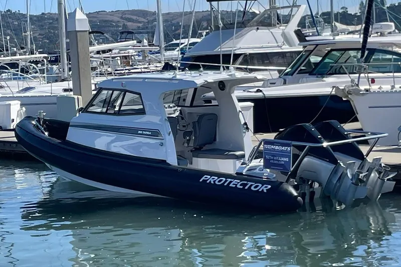  Yacht Photos Pics 2024 Protector 310 Targa boat docked, featuring V8 250 HP engine.