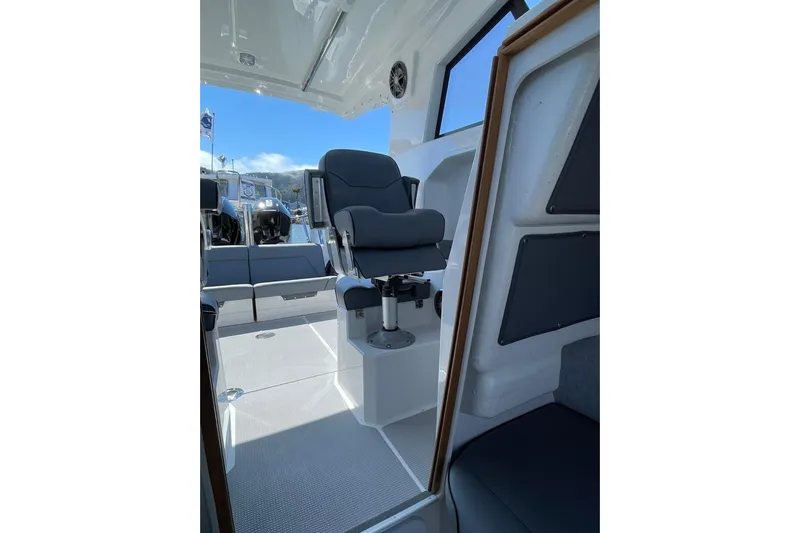  Yacht Photos Pics Interior of 2024 Protector 310 Targa boat with modern seating and sleek design.