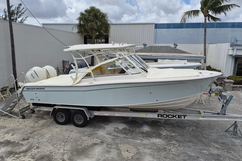 285-662 Yacht Photos Pics 2026 Grady-White Freedom 285 boat on trailer, parked outdoors.