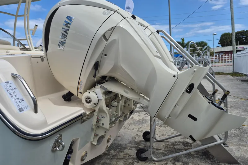 285-662 Yacht Photos Pics 2026 Grady-White Freedom 285 boat with Yamaha outboard motor, docked outdoors.
