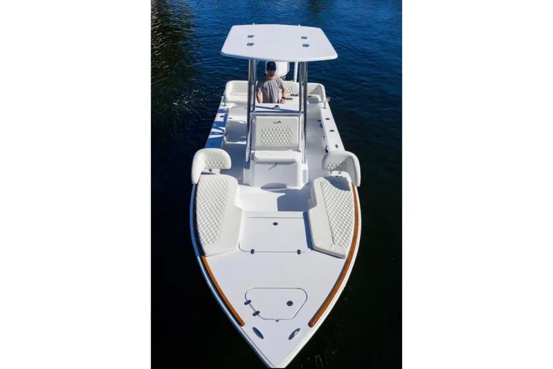  Yacht Photos Pics 2024 Billfish 24 boat on water, featuring sleek design and spacious seating.