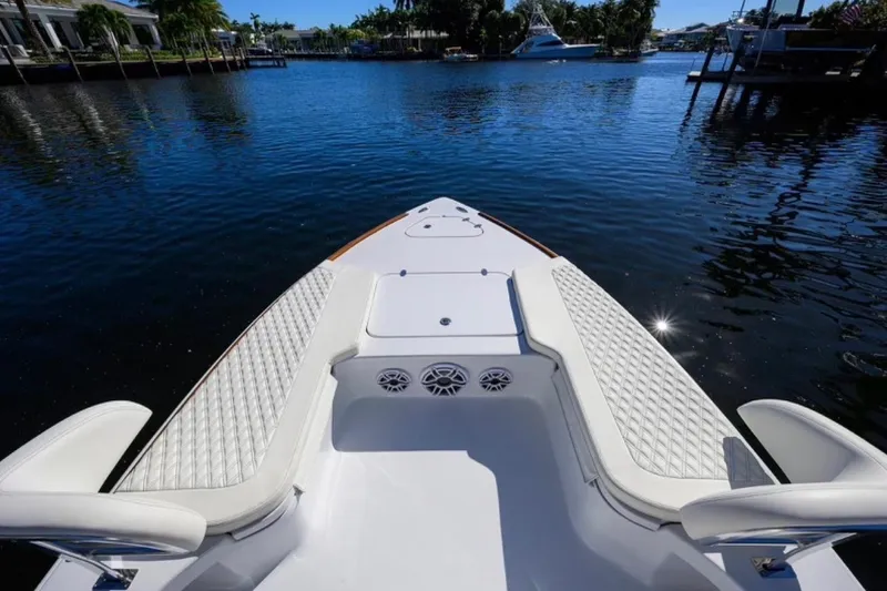  Yacht Photos Pics Bow view of 2024 Billfish 24 boat with luxurious seating on calm water.