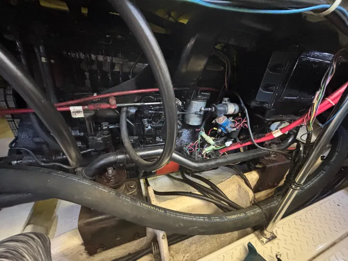  Yacht Photos Pics Engine compartment of a 1994 Bayliner 4700, showing wiring and mechanical components.