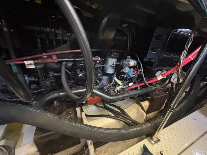  Yacht Photos Pics Engine compartment of a 1994 Bayliner 4700 boat, showing wiring and hoses.