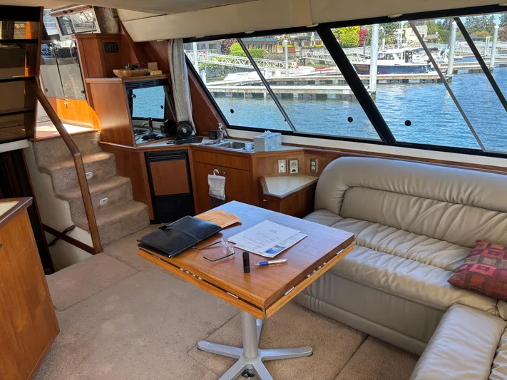  Yacht Photos Pics Luxurious interior of a 1994 Bayliner 4700 yacht with leather seating and waterfront view.