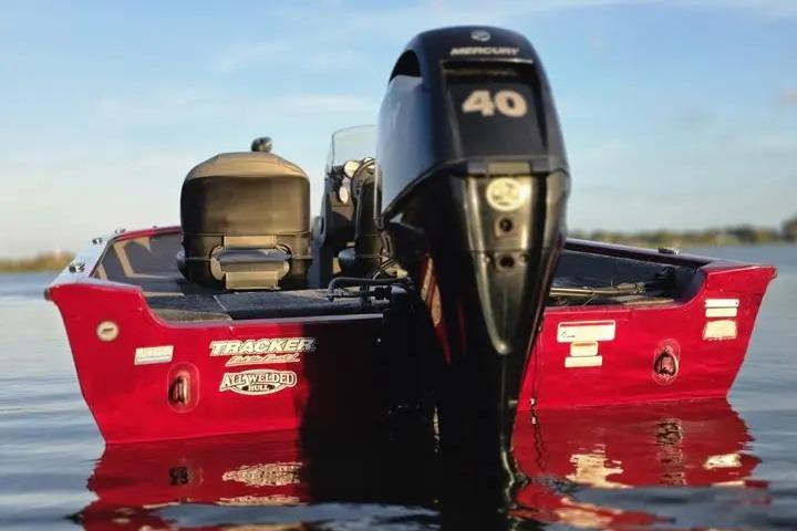 2021 Tracker Super Guide V-16 SC boat with Mercury 40 engine on calm water.