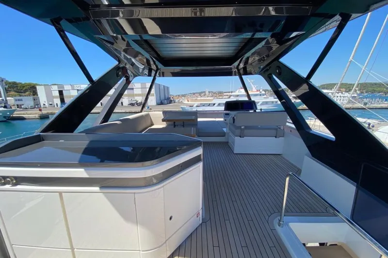  Yacht Photos Pics Luxurious 2022 Ferretti Yachts 720 deck with modern design and spacious seating area.
