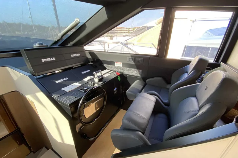  Yacht Photos Pics Interior helm of 2022 Ferretti Yachts 720 with Simrad navigation system.