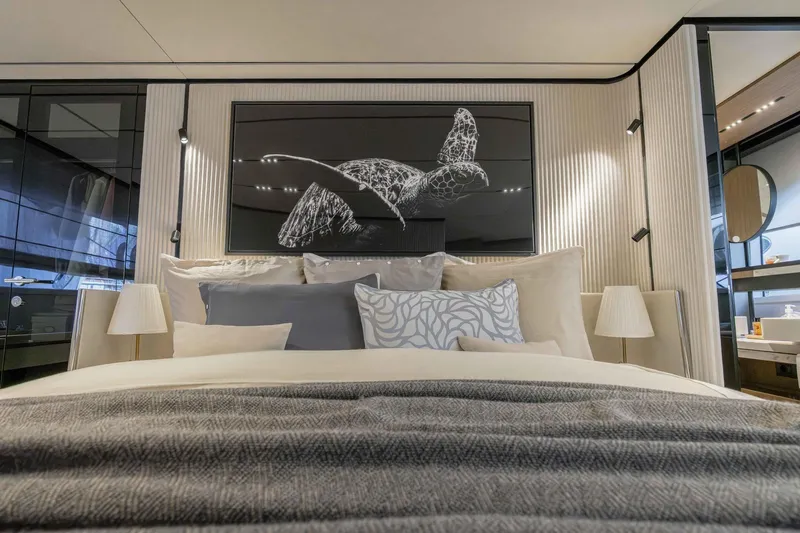  Yacht Photos Pics Luxurious bedroom interior of 2022 Ferretti Yachts 720, featuring elegant decor and modern design.
