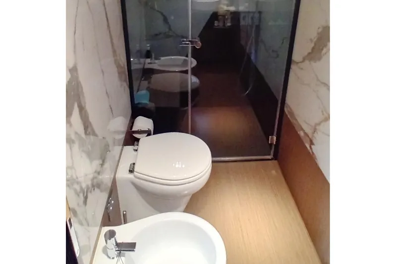  Yacht Photos Pics Luxurious bathroom in 2022 Ferretti Yachts 720, featuring modern fixtures and elegant design.