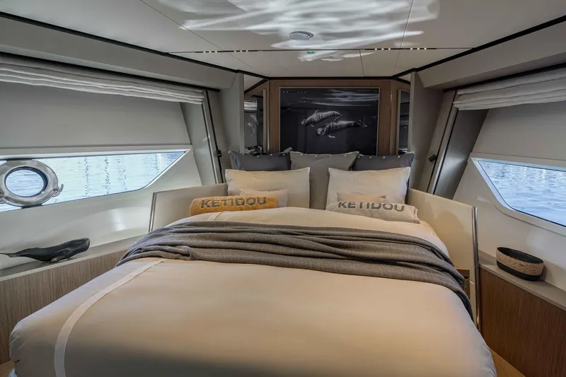  Yacht Photos Pics Luxurious bedroom interior of 2022 Ferretti Yachts 720 with elegant bedding and modern design.