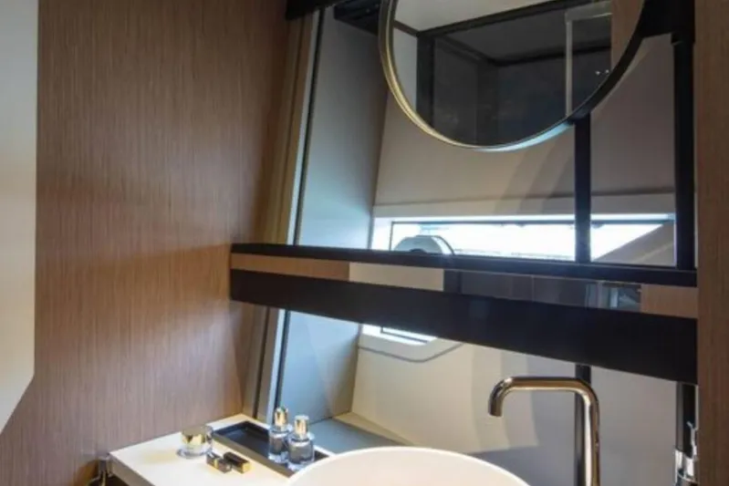  Yacht Photos Pics Luxurious bathroom interior of 2022 Ferretti Yachts 720, featuring modern fixtures and elegant design.