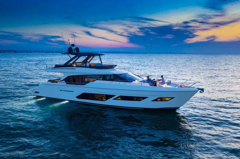  Yacht Photos Pics Luxury 2022 Ferretti Yachts 720 cruising at sunset on serene ocean waters.