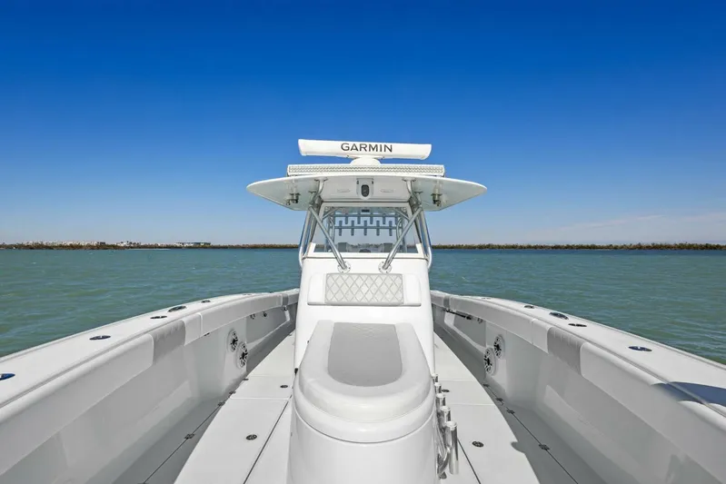  Yacht Photos Pics Freeman 34VH 2022 boat on water, featuring Garmin equipment, clear blue sky.