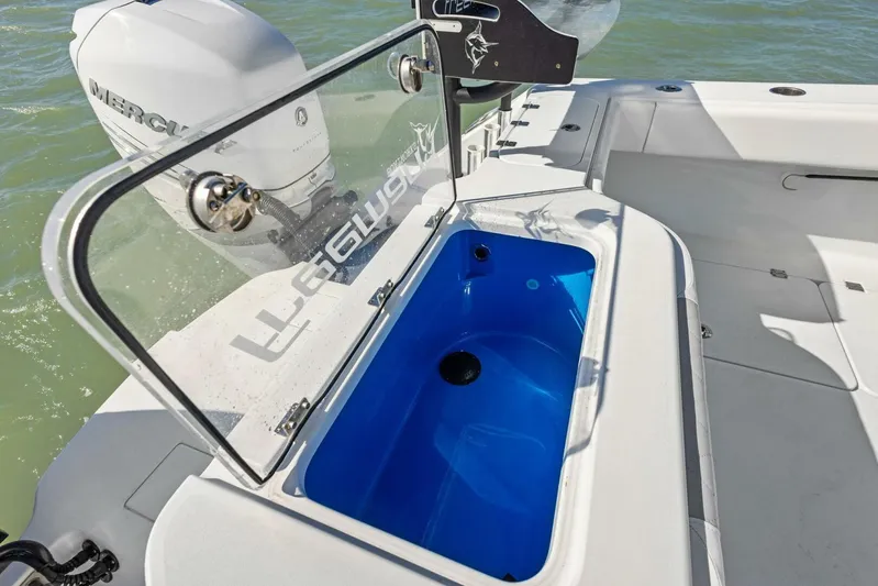  Yacht Photos Pics 2022 Freeman 34VH boat with open livewell and Mercury outboard engine.