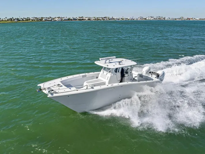  Yacht Photos Pics 2022 Freeman 34VH boat cruising on open water, showcasing sleek design and powerful performance.