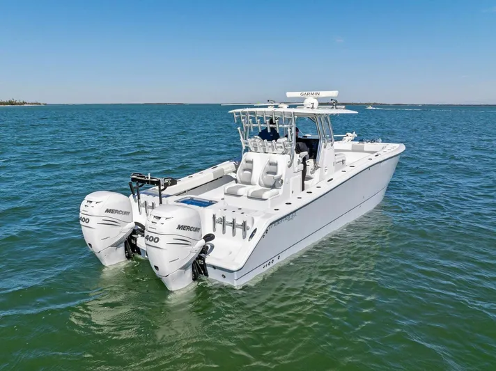  Yacht Photos Pics 2022 Freeman 34VH boat with twin Mercury engines on open water.