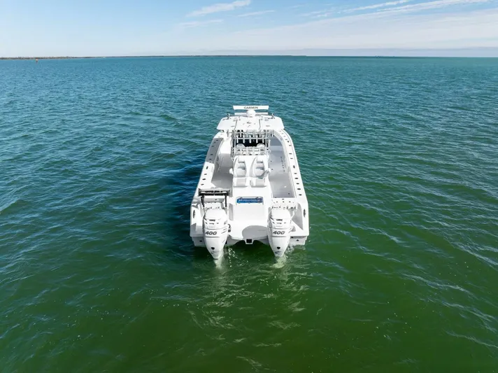  Yacht Photos Pics 2022 Freeman 34VH boat on open water, rear view, clear sky.