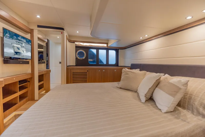 Low Key Yacht Photos Pics Luxurious bedroom interior of 2019 Absolute 50 Fly yacht with modern amenities.