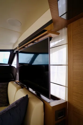 Low Key Yacht Photos Pics Interior of 2019 Absolute 50 Fly yacht with modern TV setup.