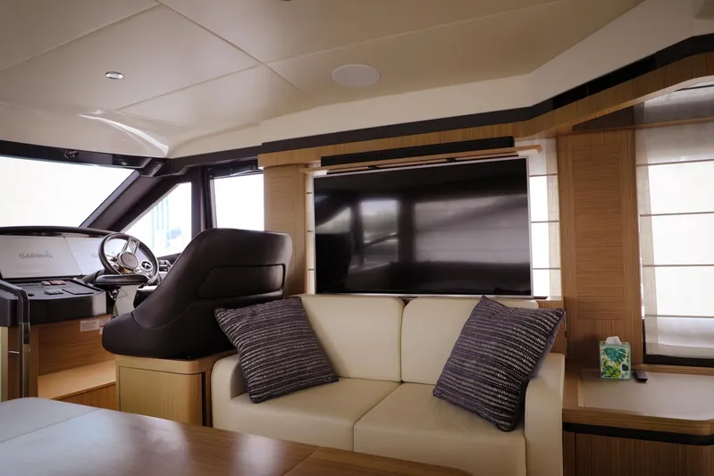 Low Key Yacht Photos Pics Luxurious interior of 2019 Absolute 50 Fly yacht with modern seating and helm.