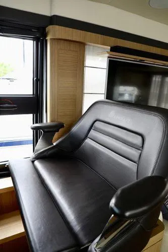Low Key Yacht Photos Pics Luxurious leather captain's chair in 2019 Absolute 50 Fly yacht interior.