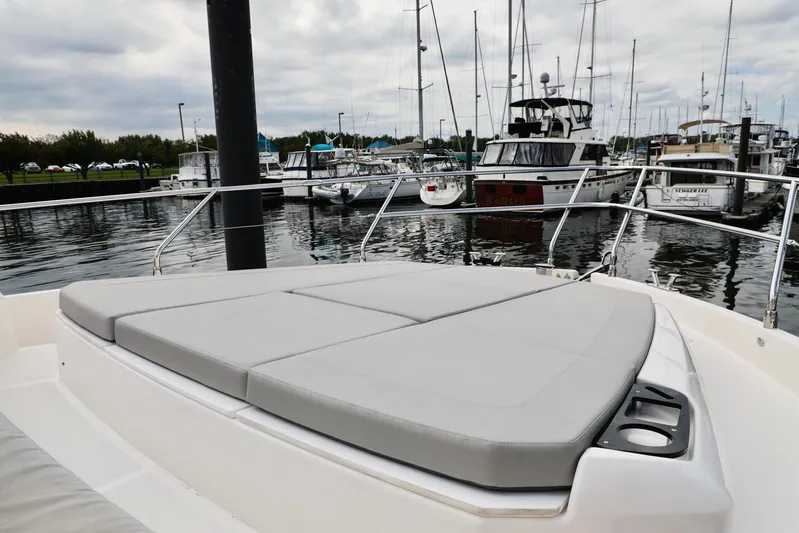 Low Key Yacht Photos Pics 2019 Absolute 50 Fly yacht with cushioned deck at marina.
