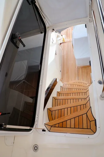 Low Key Yacht Photos Pics Staircase on 2019 Absolute 50 Fly yacht with sleek wooden design.