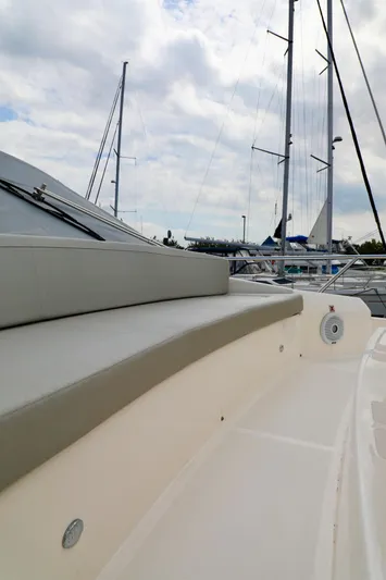 Low Key Yacht Photos Pics 2019 Absolute 50 Fly yacht deck with sleek design and marina backdrop.