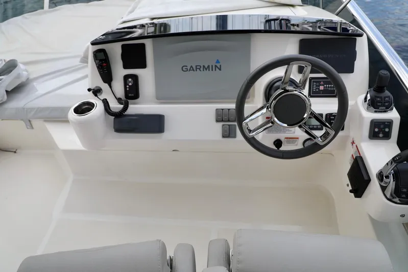 Low Key Yacht Photos Pics 2019 Absolute 50 Fly yacht helm with Garmin navigation system and modern controls.