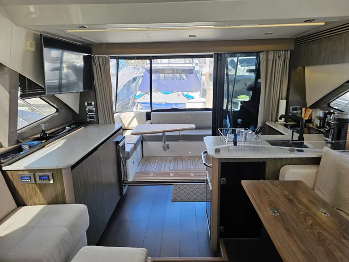 Just M Yacht Photos Pics Luxurious interior of 2018 Sea Ray Fly 460 yacht with modern amenities and elegant design.