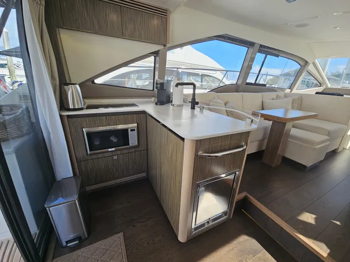 Just M Yacht Photos Pics 2018 Sea Ray Fly 460 yacht interior with modern kitchen and dining area.