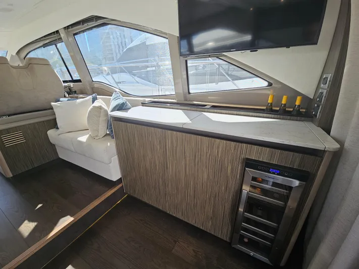 Just M Yacht Photos Pics Luxurious interior of 2018 Sea Ray Fly 460 yacht with modern seating and wine cooler.