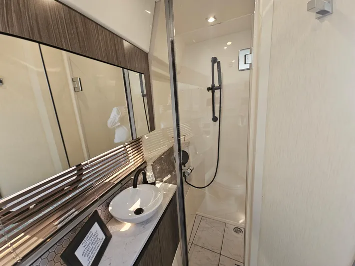 Just M Yacht Photos Pics Luxurious bathroom in 2018 Sea Ray Fly 460 yacht with modern fixtures and elegant design.