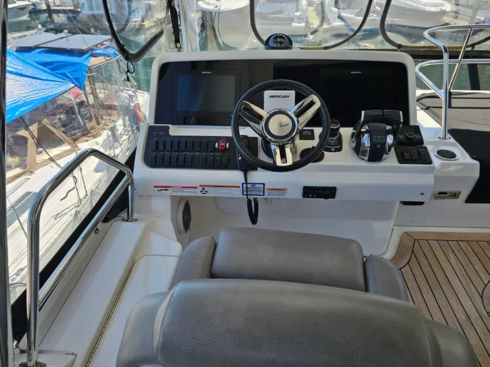 Just M Yacht Photos Pics Cockpit of 2018 Sea Ray Fly 460 yacht with modern controls and steering wheel.