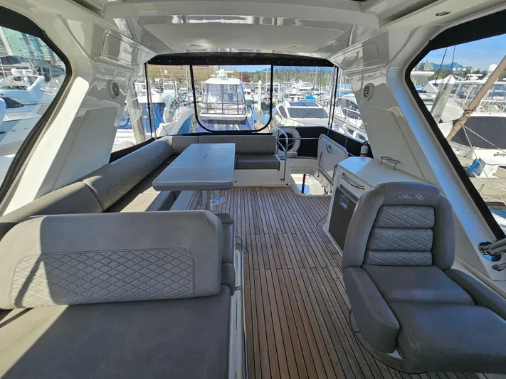 Just M Yacht Photos Pics Luxurious interior of 2018 Sea Ray Fly 460 yacht with elegant seating and wooden flooring.