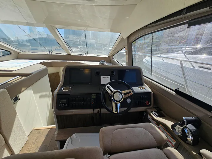 Just M Yacht Photos Pics 2018 Sea Ray Fly 460 helm with modern controls and panoramic windows.