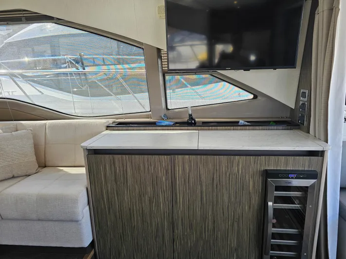 Just M Yacht Photos Pics Interior of 2018 Sea Ray Fly 460 yacht with modern furnishings and large window.