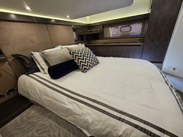 Just M Yacht Photos Pics Luxurious bedroom interior of 2018 Sea Ray Fly 460 yacht with modern decor and plush bedding.