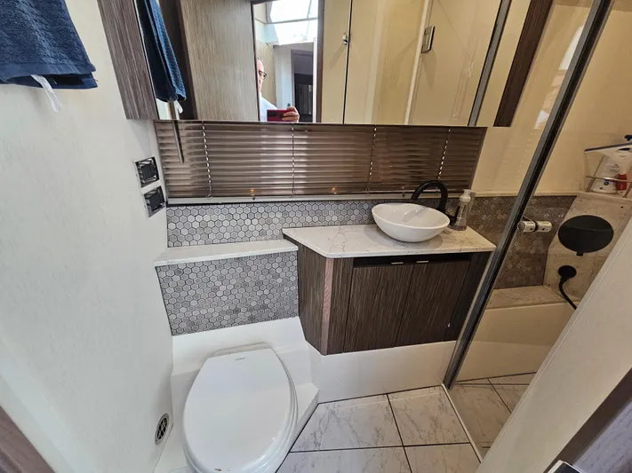 Just M Yacht Photos Pics Luxurious bathroom in 2018 Sea Ray Fly 460 yacht with modern fixtures and elegant design.