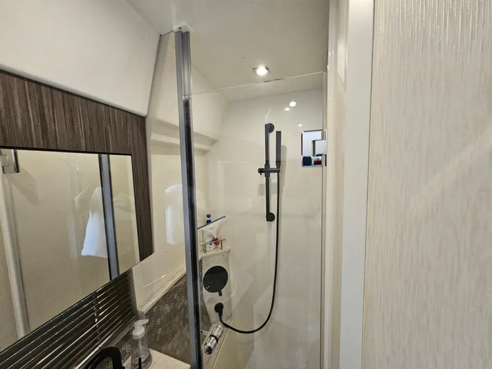 Just M Yacht Photos Pics Bathroom interior of 2018 Sea Ray Fly 460 yacht, featuring modern shower design.