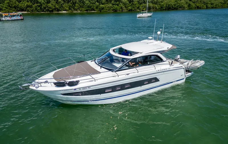  Yacht Photos Pics 2019 Jeanneau Leader 40 yacht cruising on a serene lake.