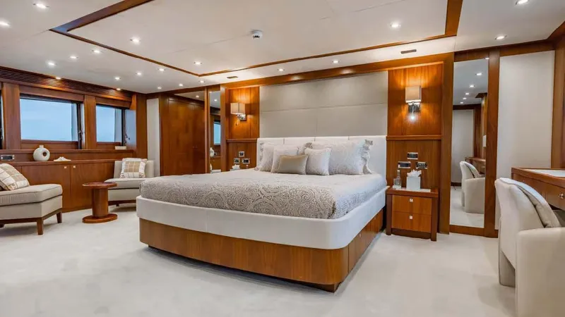 Mercy Yacht Photos Pics Luxurious bedroom interior on 2009 Sunseeker 37 Metre Yacht, featuring elegant wood finishes and modern design.